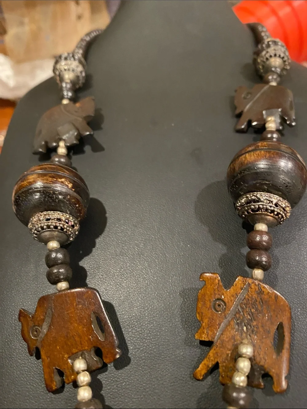 Handcrafted Elephant Pendant Necklace - Brown. Small elephants are bone.
